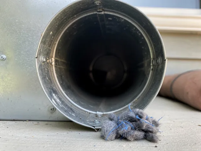 Chino Hills Dryer Vent Cleaning technician using specialized equipment to clear severe dryer vent blockage in Chino Hills